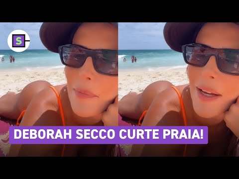 Deborah Secco enjoys the beach with her daughter and shows off her bikini-clad backside in a video.
