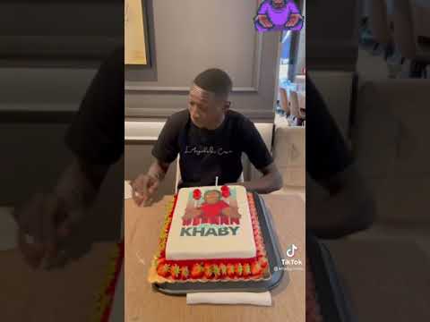 khaby_lame react to the queen cutting the cake with the knife back way