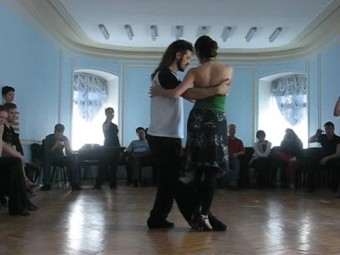  Diego Riemer  and  Maria Belen Giachello  are  dancing  to  a  tango