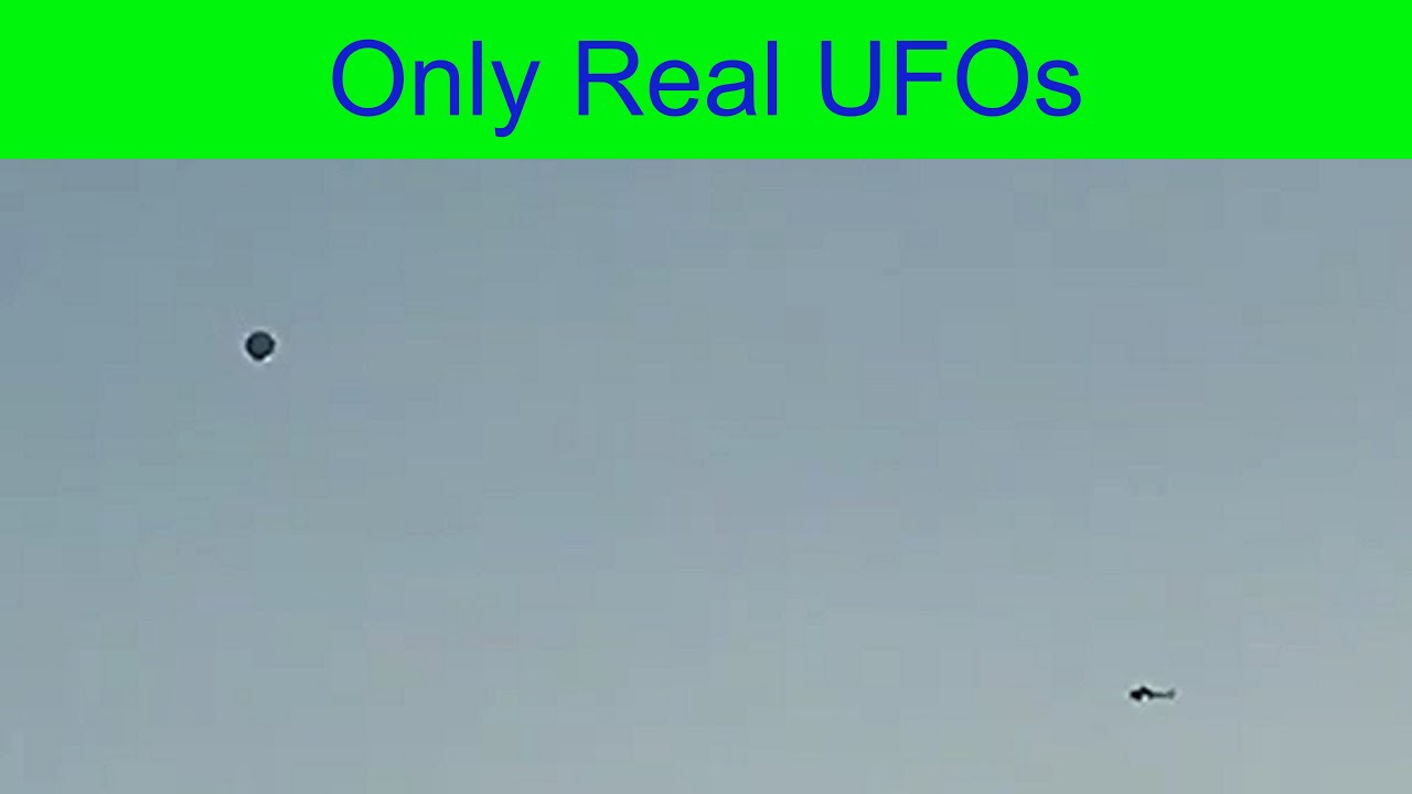 The helicopter flies around UFO at a considerable distance. Los Angeles, California. 8/28/2017.