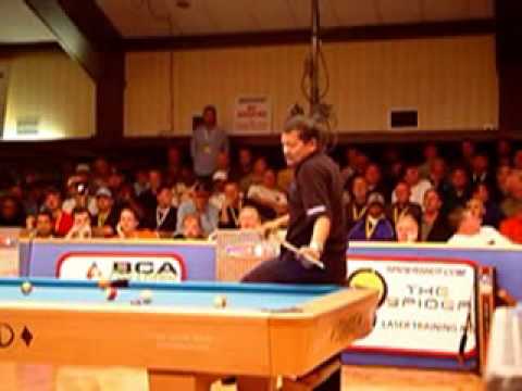 Efren Reyes masses a pool ball in a tournament