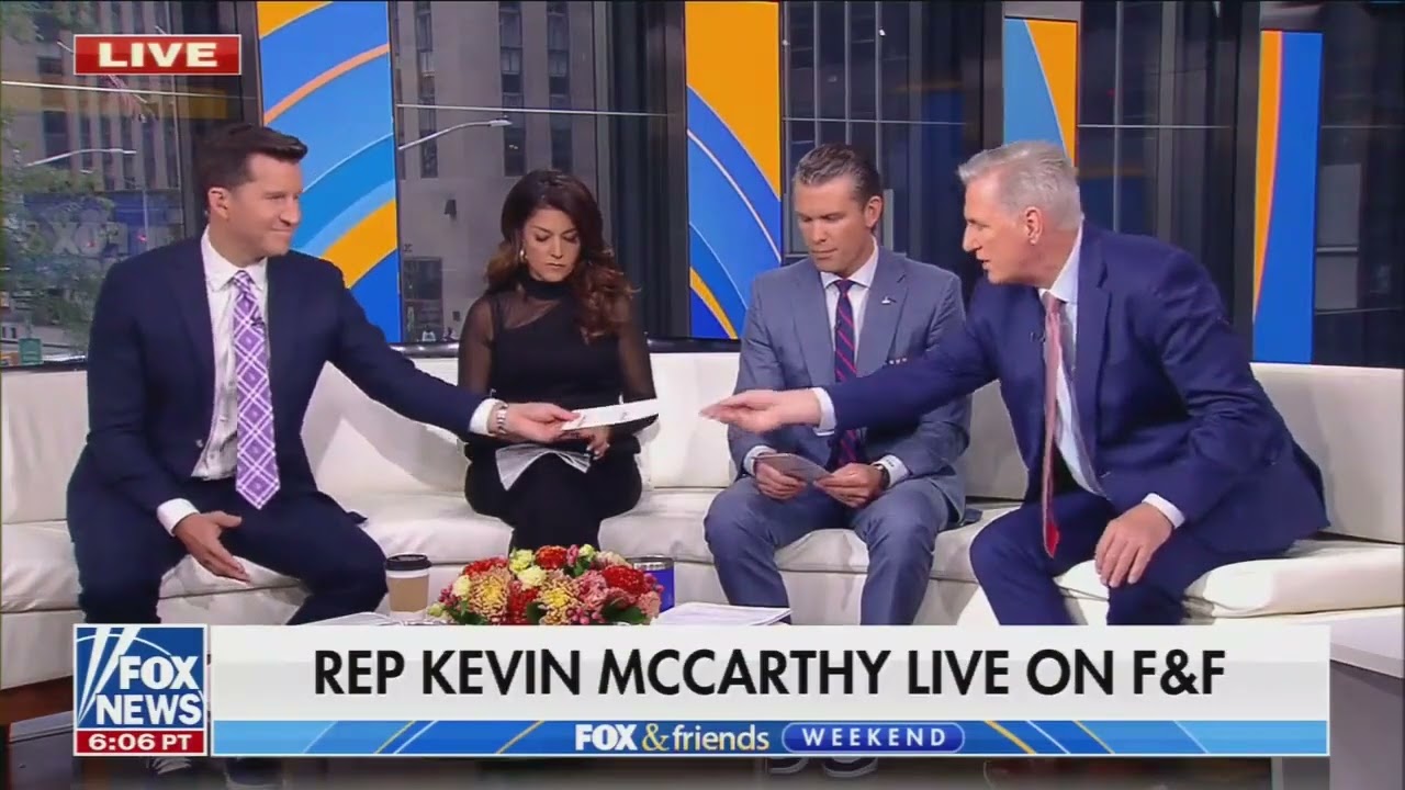 House Minority Leader gives meaningless brochure to Fox hosts