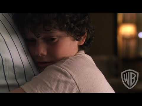 Trailer montage: bicycles, porches, and shadowed streets; score hush with period radio songs
