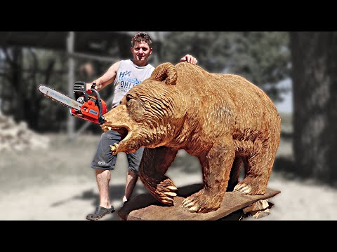 wooden sculpture of a bear using chainsaw by vlad