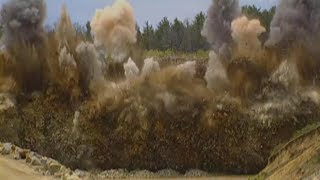Blasting Crew Loading Explosives And Blowing Up Solid Rock At A Quarry