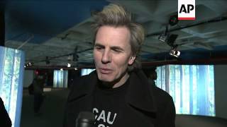 Duran Duran's John Taylor supports wife as she holds first show in NY City parking garage