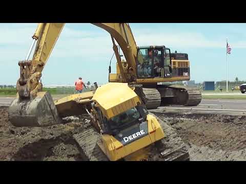 caterpillar 345c Excavator loading trucks And operator view