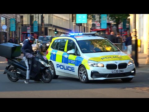 Near miss! Moped rider almost crashes into police car responding in London