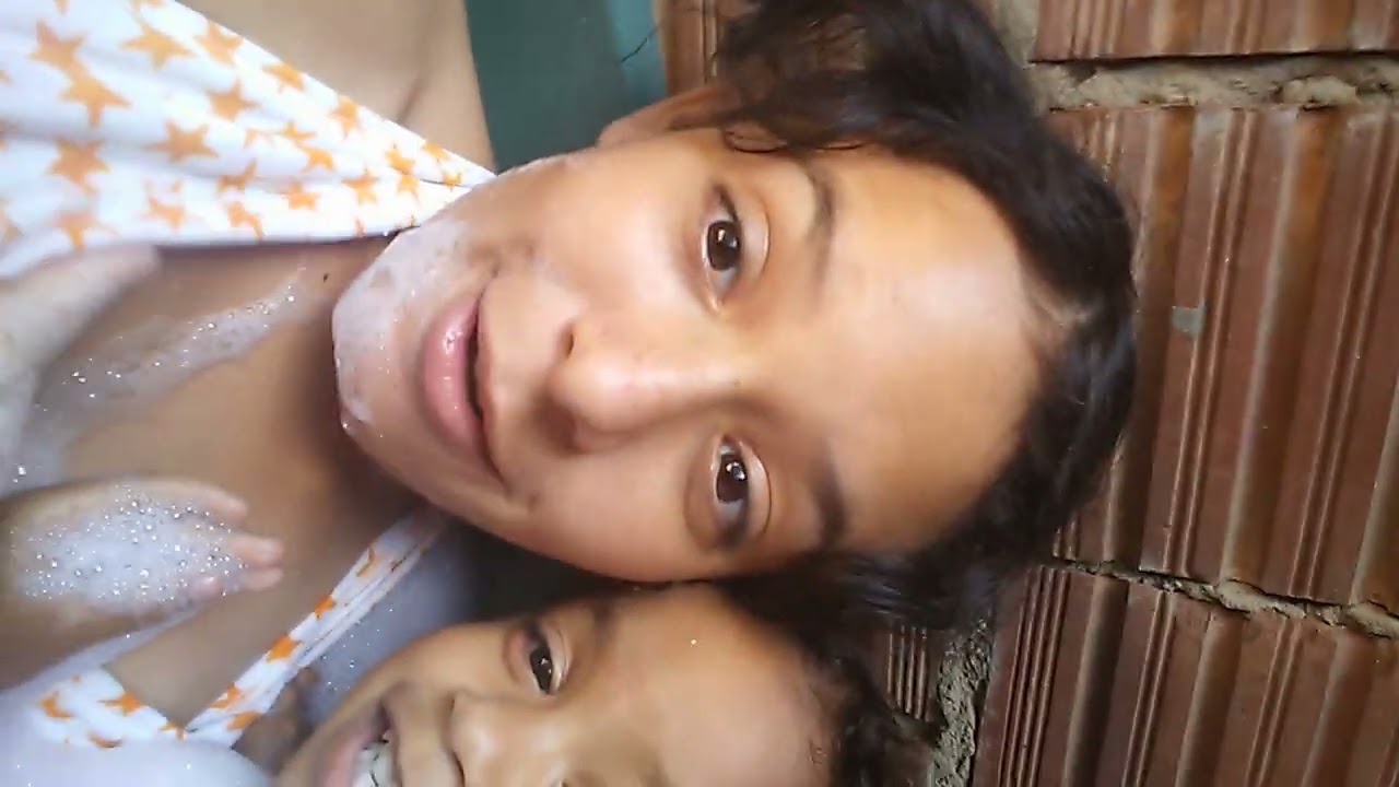 taking a bath and a basin with my little sister