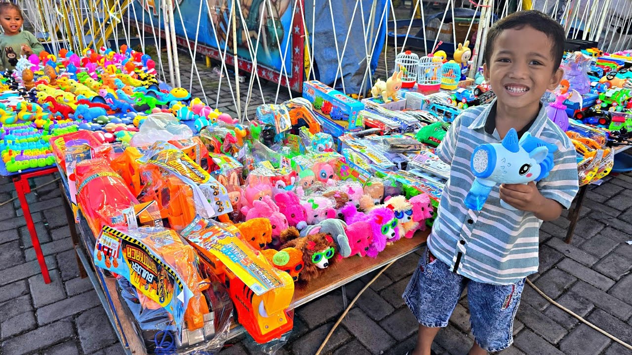 GO TO THE NIGHT MARKET, BUY TOYS AND RIDE THE RAINBOW SLIDE, TRAMPOLINE & BUY COTTON CANDY