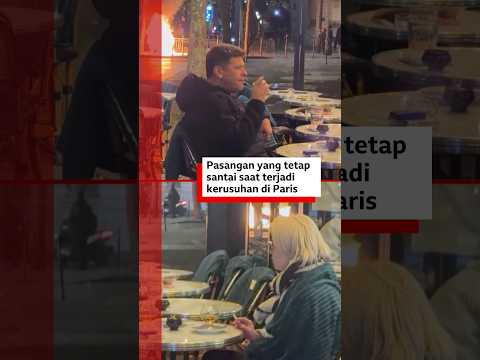 Pasangan ini tetap santai di kafe meskipun ada kerusuhan di Paris - BBC News Indonesia