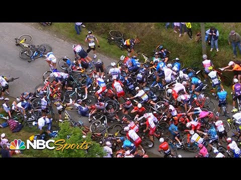 Watch The World's Worst Fan Cause A Massive Crash On Stage 1 Of The Tour de France, Knocking Down Half The Racers
