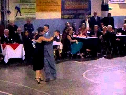  Ayelén Maldonado  and  Martin Luna  are  dancing  to  a  tango