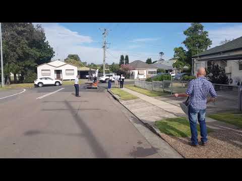 Best man arriving in style at a Macedonian wedding with an excavator