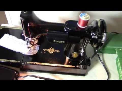 1951 Singer Featherweight 221 Centennial doing a zigzag stitch.