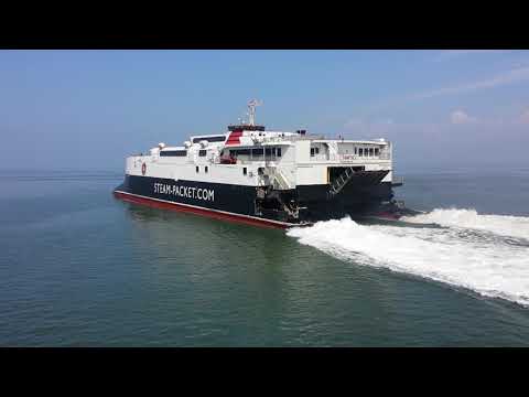 High speed catamaran leaving heysham harbour.