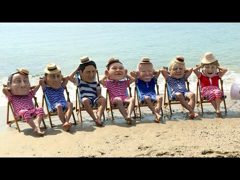 Oxfam campaigners in Cornwall pose as G7 leaders, urging action against climate change | AFP