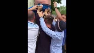 The Tango Man getting helped up a tree in St Etienne this afternoon.