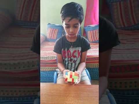 Siddhartha solving the Rubix Cube puzzle in 45 seconds.... Check out his magic....