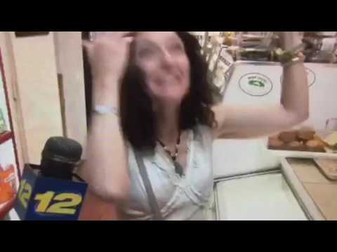 Carolyn hits her head on reporters microphone. She is extremely excited to be interviewed!