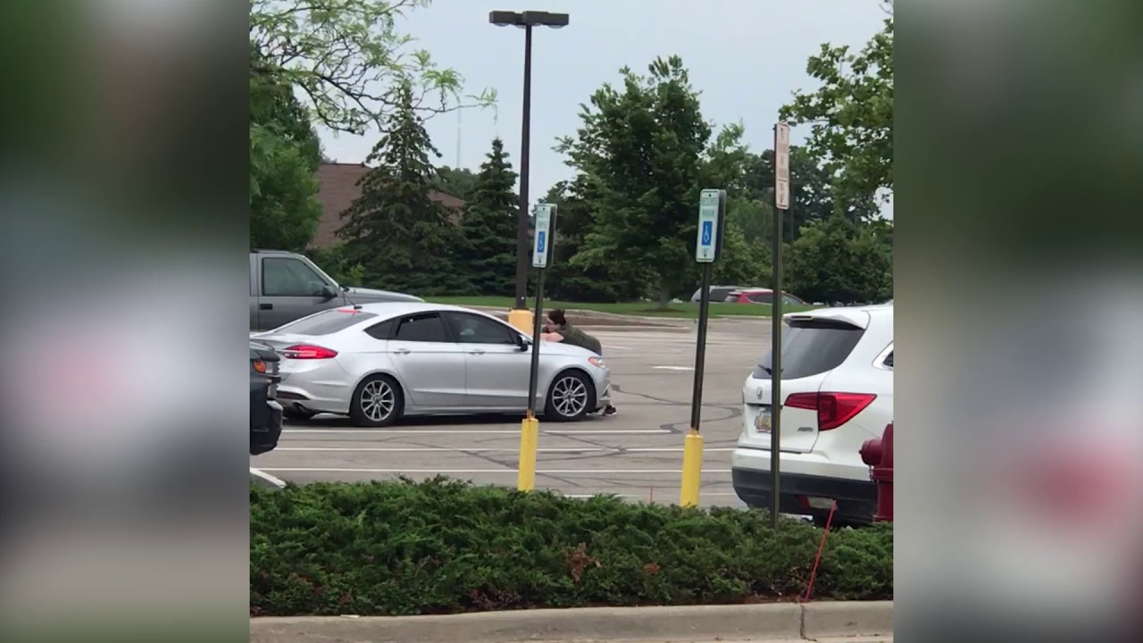 Random Woman Tries to Stop Shoplifters by Jumping on the Hood of Their ...