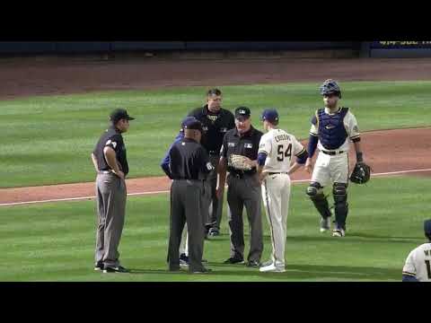 Another ejection in MLB, Brewers pitcher Jake Cousins is using a glove that is too light of a color.
