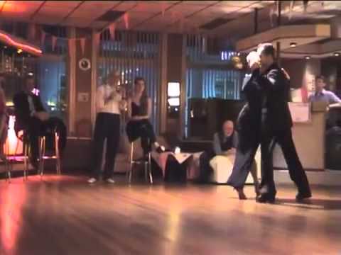  Michael Nadtochi  and  Eleonora Kalganova  are  dancing  to  a  tango  by  Juan D'Arienzo