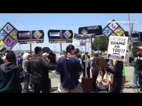 Environmental activists protest "bomb trains" of crude oil at Kinder Morgan rail terminal in Richmon