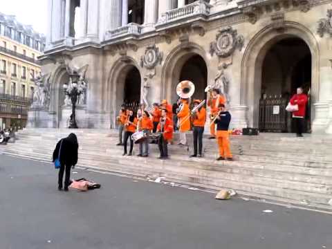Groovy brass band in front of Paris opera house.