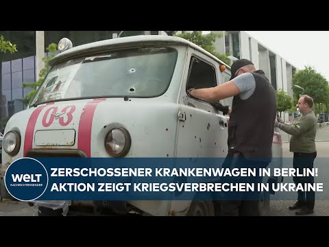 UKRAINE-MAHNMAL: Zerschossener Krankenwagen aus dem Krieg gegen Russland steht vor dem Reichstag