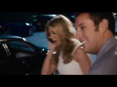 Just Go with It (2011) official trailer frame: Sandler and Aniston arriving at a Hawaiian resort