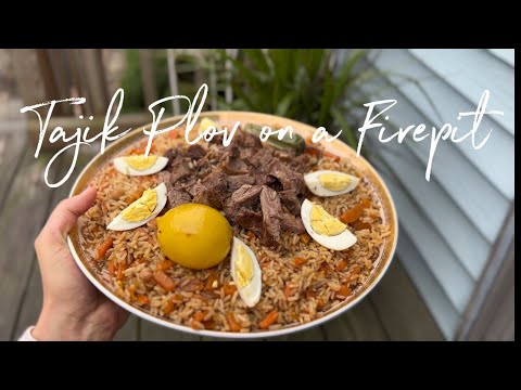 Traditional Tajik Plov Cooked Outdoors Over Open Fire. Backyard Vibes. Cozy Autumn Weekend.