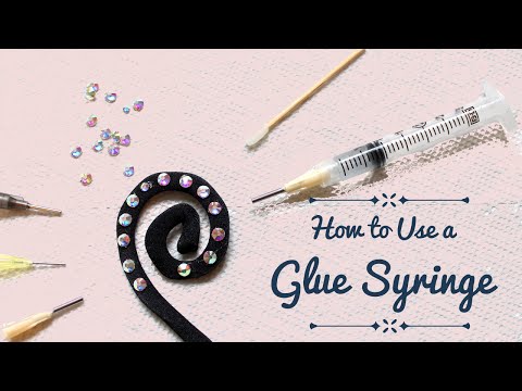 Part of a video titled How to Use a Glue Syringe - glue applicator syringe for rhinestones