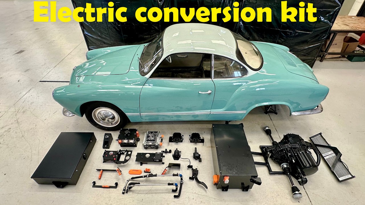 Volkswagen Karmann Ghia alongside an electric conversion kit on a test bench