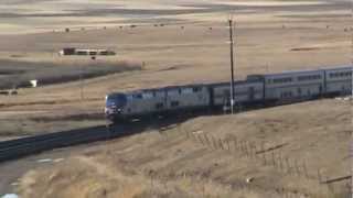 preview picture of video 'Amtrak Passing Camp Disappointment Monument'
