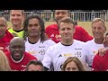 Macron makes the ceremonial kickoff in a charity soccer match
