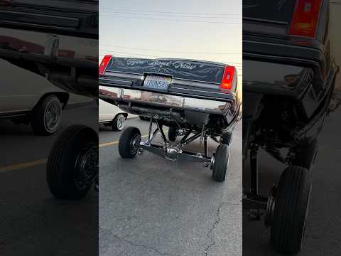Oldsmobile Cutlass G Body LOWRIDER hitting switches, raising up to show off all that chrome plating!