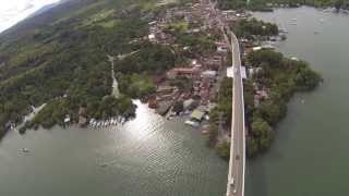 preview picture of video 'Quadrocopter flight over the  Rio Dulce bridge Central America'
