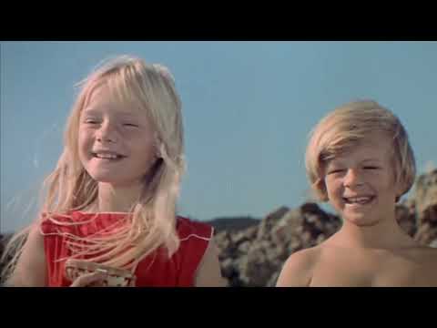 Trailer shot of village crowds cheering as Chitty rolls by—aural stand-in for the finale reprise energy