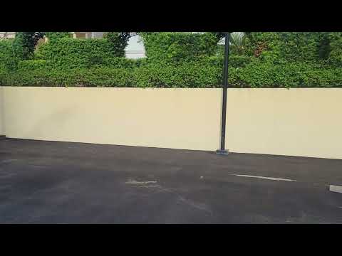Finishing a tennis court in West Palm Beach, FL