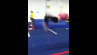Standing back handspring tuck