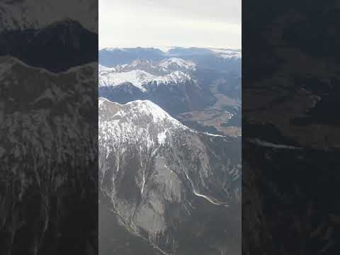 Take off from Innsbruck (Kranebitte) Airport and flying over the Alps