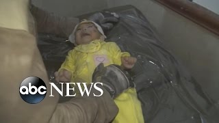 Rescue Worker Cries after Pulling Baby From Rubble in Syria