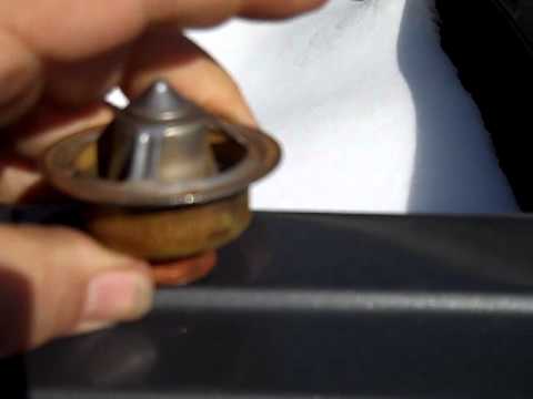 How To change thermostats on a John Deere Backhoe 415-B