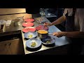 Busy kitchen service at 1 Michelin star restaurant Ikoyi in London, United Kingdom