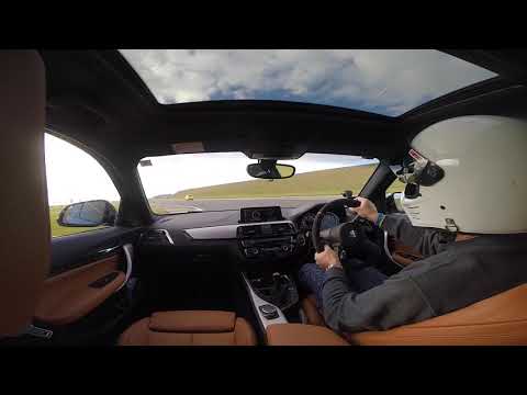 BMW M140i with Akrapovic exhaust on track