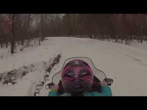 Katie driving snowmobile in roscommon