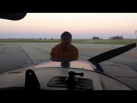 Brian pushing plane in hangar