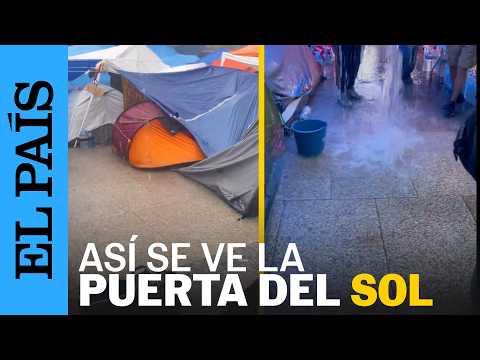 MADRID | La Puerta del Sol, bajo la lluvia: así resisten los acampados