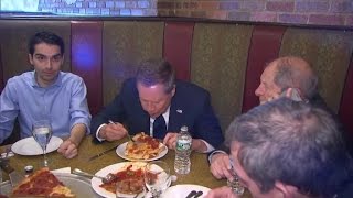 Kasich eats New York pizza with a fork